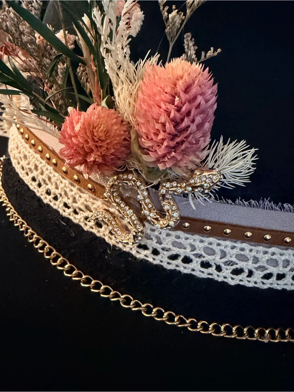 Black Wide-Brim Fedora with Decorative Band and Floral Accent